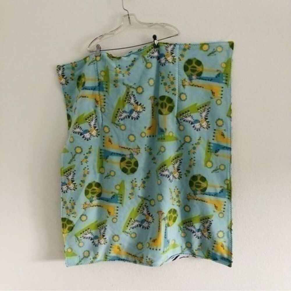 Baby blanket 40”x33” reversible warm folds into a pillow